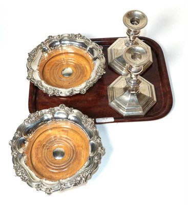 Lot 37 - A pair of octagonal silver candlesticks, Mappin & Webb, Sheffield 1935, filled; and a pair of...