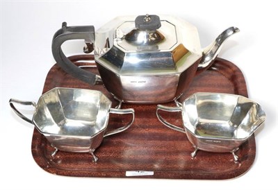 Lot 42 - A three piece silver tea service, Harrison Fisher & Co, Sheffield 1945, the teapot 25.5cm long,...