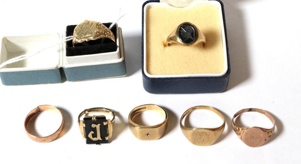 Lot 56 - Five various 9 carat gold signet rings, finger sizes L1/2, R1/2, S, U1/2 and V; a 9 carat gold band