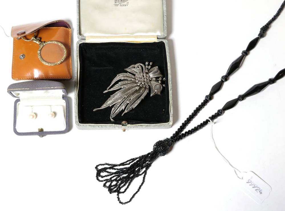 Lot 71 - A silver marcasite set brooch; a gilt metal magnifying glass; a black jet necklace; and a pair...