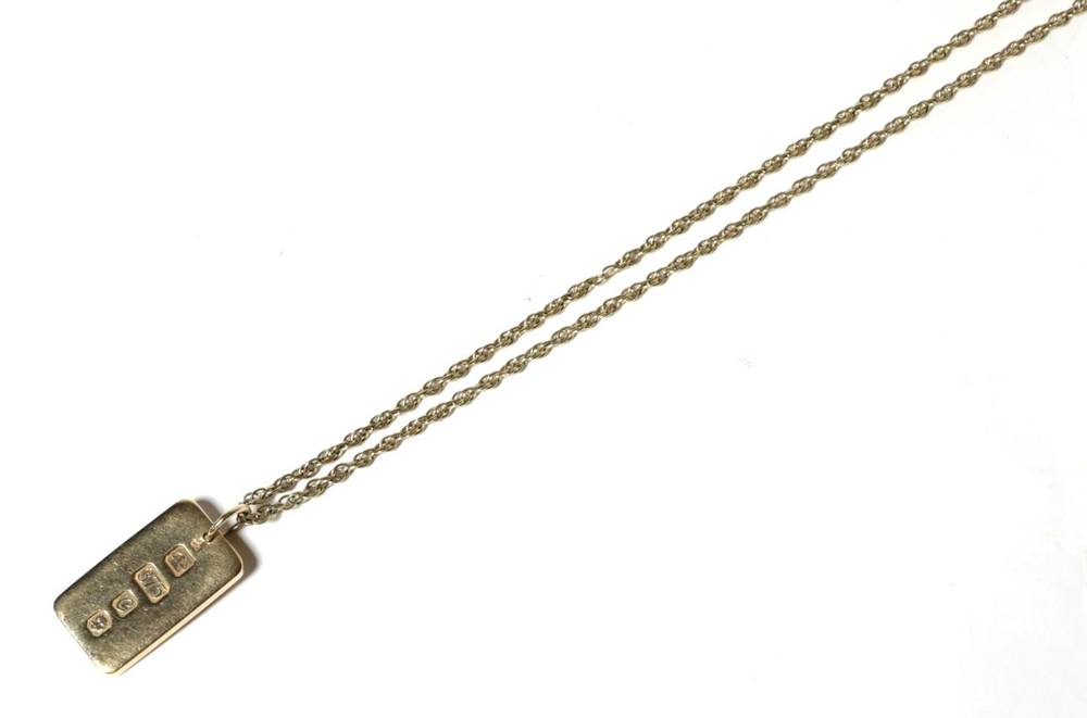 Lot 85 - A 9 carat gold ingot pendant, on 9 carat gold chain, pendant length 3.5cm, chain length 59cm