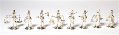 Lot 98 - A set of eight novelty white metal figural name card holders, stamped 'sterling'