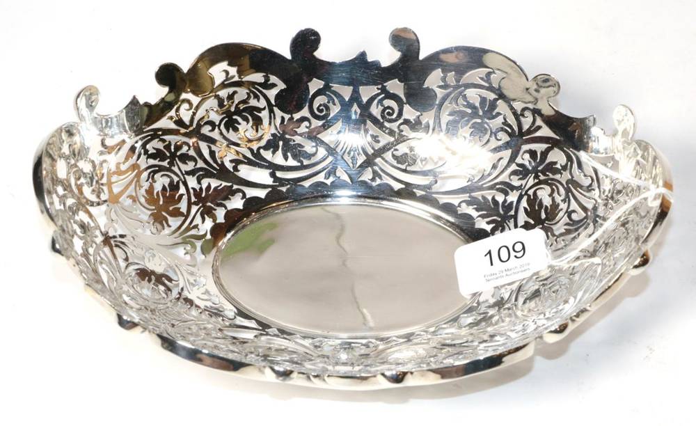 Lot 109 - An Edwardian pierced oval silver bowl, Thomas Levesley, Sheffield 1902, with shaped scrool rim, the