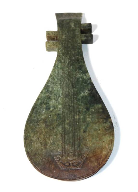 Lot 121 - A Chinese carved spinach jade stringed instrument, 20th century four character marks, 31.5cm long