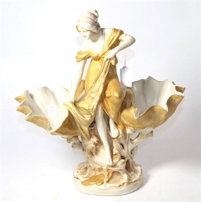 Lot 122 - A Royal Dux blush ivory figural twin bowl in the form of a wash maiden and shells, 34cm high