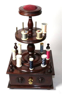 Lot 125 - A composite mahogany two tier bobbin stand with pin cushion mount, single drawer to the front...