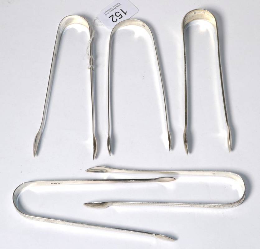 Lot 152 - Five pairs of George III and later silver sugar tongs, 5.7ozt
