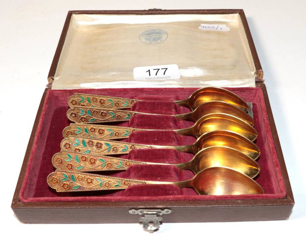 Lot 177 - A set of six Russian Soviet silver gilt and enamel tea spoons, in a fitted box, 4.4ozt