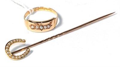 Lot 182 - A 15 carat gold seed pearl ring, finger size N1/2; and an unmarked seed pearl horseshoe stick pin