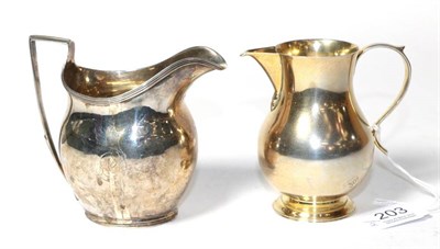 Lot 203 - A silver gilt baluster cream jug of 18th century style, J B Chatterley & Sons, London 1933; and...