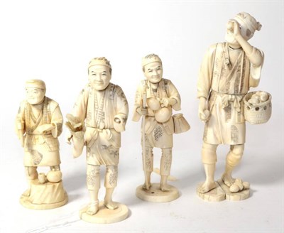 Lot 222 - A Japanese carved ivory okimono, late 19th Century, of a man with a basket of fruit (?);...