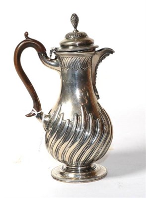 Lot 228 - A Victorian silver hot water jug, Charles Stuart Harris, London 1890, baluster part fluted with...