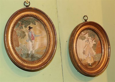 Lot 235 - A pair of early 19th century needlework embroideries of a lady and gentleman in a country...