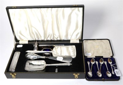 Lot 245 - A silver dressing table set; a set of six silver trefid teaspoons; a shoehorn; a pepper and...