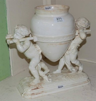 Lot 271 - A Victorian blanc de chine centrepiece, cherubs carrying amphora on integral base, 32cm high