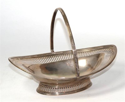 Lot 284 - A pierced silver navette shape swing handled basket, makers mark rubbed, London 1901, 30cm...