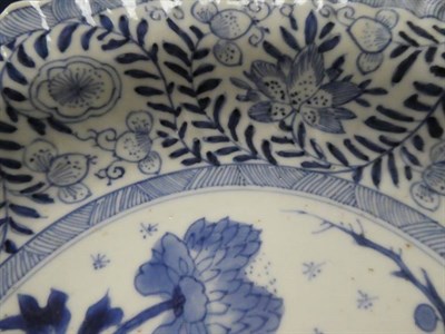 Lot 286 - An 18th century Chinese blue and white porcelain tea bowl and saucer, decorated with a band of...
