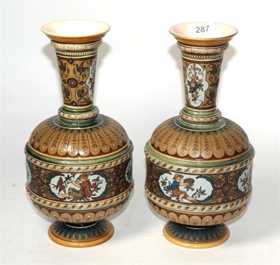 Lot 287 - A pair of German Mettlach stoneware bottle vases, circa 1900, both damaged (2)