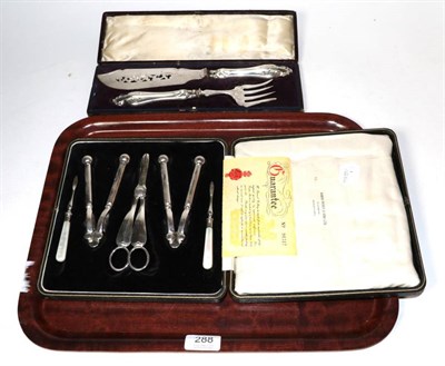 Lot 288 - A cased silver-plated set of nutcrackers, picks and grape scissors, by Manoah Rhodes & Son Ltd;...