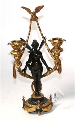 Lot 306 - A bronze and ormolu figural twin branch candlestick, 32cm high.