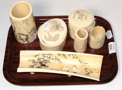 Lot 309 - Two Japanese ivory boxes and covers decorated with animals; a similar frog tusk vase; another...