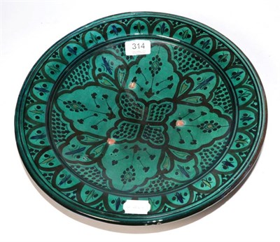 Lot 314 - An Iznik style shallow footed bowl, signed to base