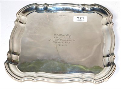 Lot 321 - A shaped square silver salver, Harrison Fisher & Co, Sheffield 1934, on four scroll feet,...