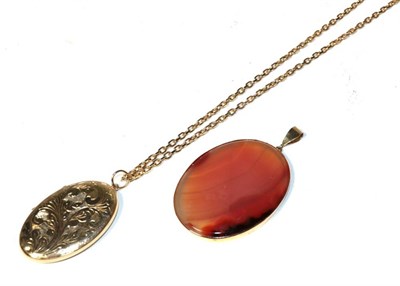 Lot 329 - A 9 carat gold locket on chain, chain stamped '375', of oval form with chased detail, pendant...