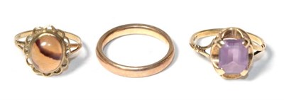 Lot 334 - A 9 carat gold band ring, finger size L1/2; a 9 carat gold stone set ring, finger size K; and...