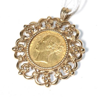 Lot 341 - A Victorian 1856 gold sovereign in a 9 carat gold pierced mount, measures 3.8cm by 4.5cm