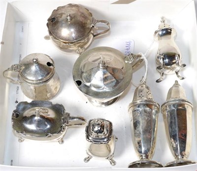 Lot 357 - Two three piece silver condiment sets, various makers, and two further mustard pots, 10.7ozt