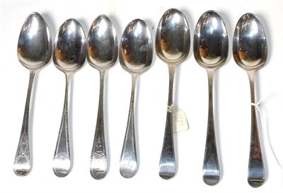 Lot 371 - A set of three George III silver feather edge table spoons, Thomas Chawner, London 1773, a...