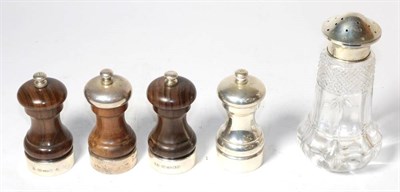 Lot 375 - Four various silver mounted salt and pepper mills; and a glass caster with associated silver top