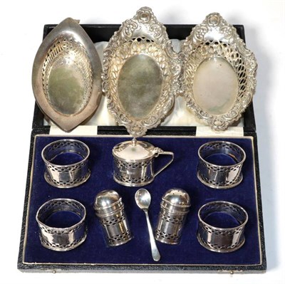 Lot 383 - Two pairs of pierced silver bon bon dishes, Birmingham 1910 and 1908; and a cased seven piece...