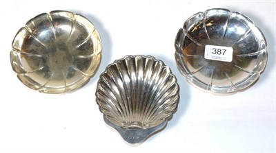 Lot 387 - A pair of small strawberry type dishes, HB, London 1968; and a silver butter shell, George...