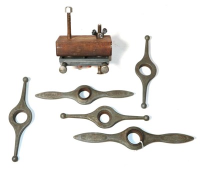 Lot 389 - Five Rolex case back opening tools and a Rolex watch clamp