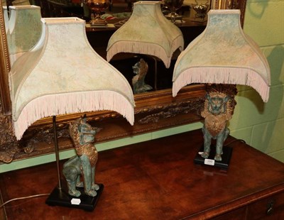 Lot 399 - A pair of gilt metal figural lamps in the Oriental style, with shades