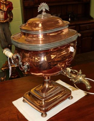 Lot 402 - An early 19th century twin handled copper and brass samovar