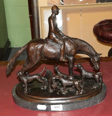 Lot 406 - A bronze figure group of a huntsman with dogs