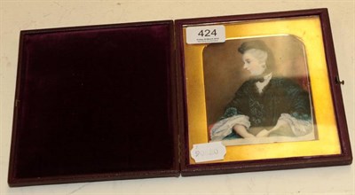 Lot 424 - Victorian school: a miniature portrait of a lady, half length seated, wearing a black scarf and...