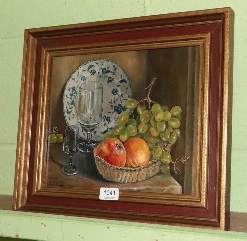 Lot 1041 - Jean Cook RA, Still life of fruit, wine glasses and a blue and white plate, signed, oil on...