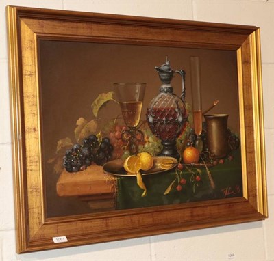 Lot 1061 - A still life with a decanter and lemons, oil on canvas, indistinctly signed and dated 98 lower...