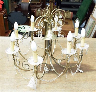 Lot 1109 - An eight light chandelier