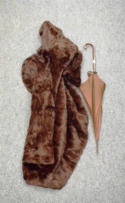 Lot 1137 - A brown fur jacket and Paragon parasol (2)
