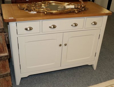 Lot 1193 - A three drawer, two door painted kitchen dresser