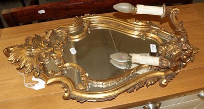 Lot 1194 - A gilt wood mirrored wall sconce in the rococo taste (a.f.)