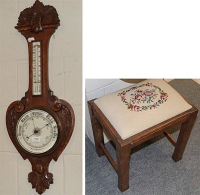 Lot 1195 - Carved oak barometer and an oak dressing stool with drop-in seat