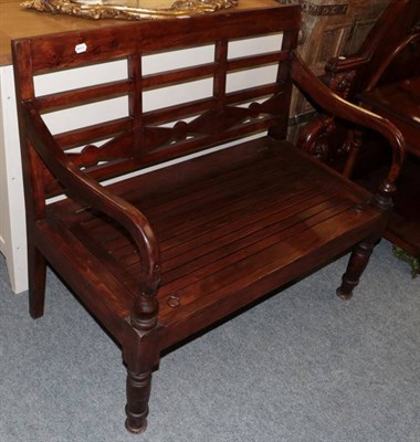 Lot 1196 - Modern teak bench with slatted hinged seat
