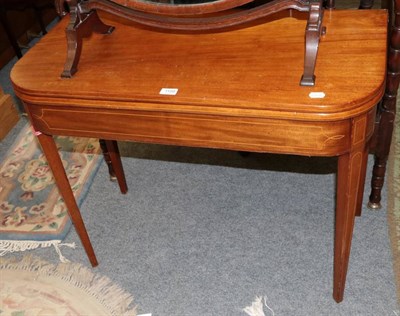 Lot 1199 - A George III inlaid mahogany fold over tea table