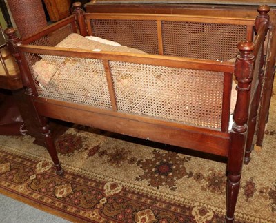 Lot 1204 - A Victorian mahogany cane sided crib